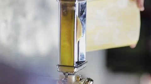 Creating fresh pasta from scratch using a traditional machine Stock Footage 339383206