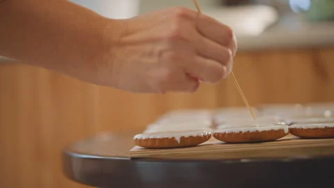 Creating glossy glaze on freshly baked pumpkin pies in warm kitchen. Artistic Stock Footage 346389866
