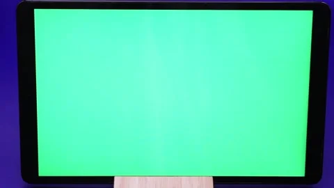 Creating a green screen effect for video editing in a home studio setup Stock Footage 295003186