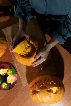 Creating Halloween Decorations by Carving Pumpkins and Preparing for the Holiday Stock Photos
