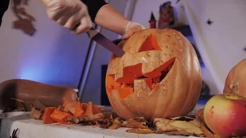 Creating a Halloween pumpkin. Preparing for Halloween. Video stock 320800843