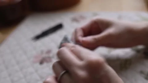 Creating a handmade textile with decorative hand stitching Stock Footage 315084867