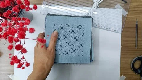 Creating Japanese Sashiko Pattern by Hand.  Stock Photos