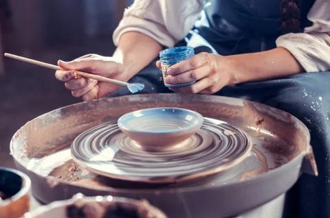 Creating a jar or vase. Master crock. Making clay jug. The sculptor in the Stock Photos