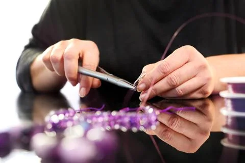 Creating jewelry. Stock Photos