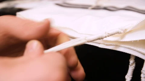 Creating knots on strings Stock Footage 99721526