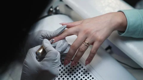 Creating magnetic glitter pattern on gel nail coating Stock Footage 343803292