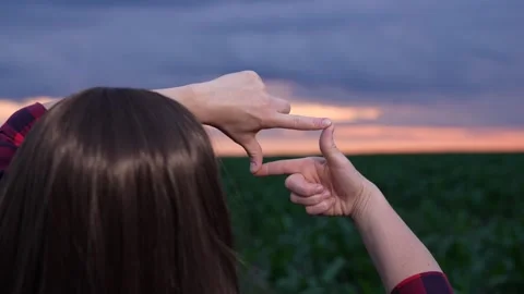 Creating mental pictures, Preparing for a shot, Framing the sunset, Warm Stock Footage 316174128
