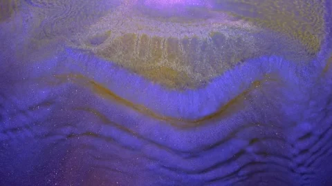 Creating mesmerizing alcohol ink art with swirling blue tones at a bright studio Stock Footage 289518006
