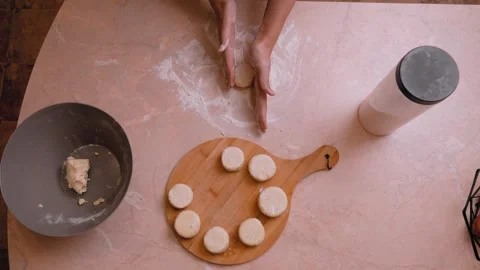 Creating miniature dough circles for steaming or frying process Stock Footage 328494659