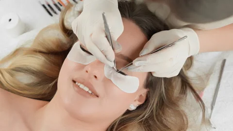 Creating natural look for eyelash extensions that cannot even be distinguished Stock Footage 240112774