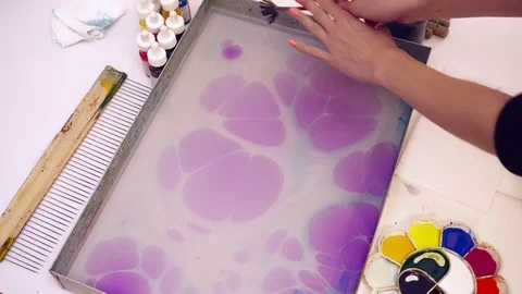Creating painting using the ebru technique Stock Footage 74719807
