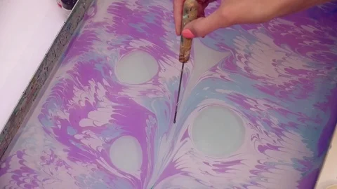 Creating painting using the ebru technique closeup Video stock 74719924