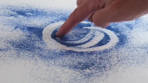 Creating patterns with sand using fingers in a simple art project Stock Footage 340461906