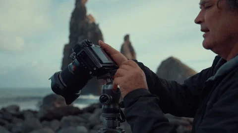 Creating the perfect shot by assembling a tripod at the beach Stock Footage 321464915