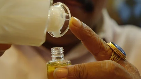 Creating a perfume by mixing different ingredients. Stock Footage 129130530