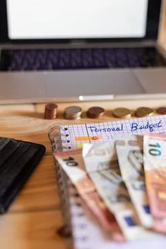 Creating personal budget plan using notebook and laptop Foto stock