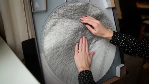 Creating a picture in the technique of string art from threads Stock Footage 169625239