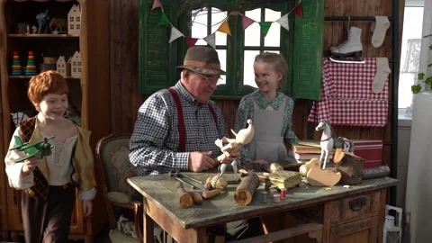 Creating Pinocchio in a carpenter's workshop . Stock Footage 147143141