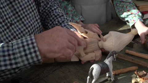 Creating Pinocchio in a carpenter's workshop . 스톡 동영상 147143160