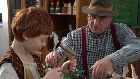Creating Pinocchio in a carpenter's workshop . Stock Footage 147143188