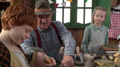Creating Pinocchio in a carpenter's workshop . Stock Footage 147143201