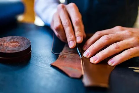 Creating process of the leather things in the handmade workshop Stock Photos
