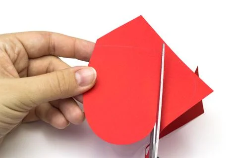 Creating red heart of colored paper pattern Stock Photos