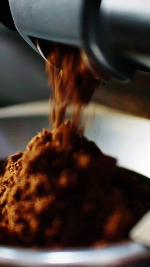 Creating rich coffee grounds for a perfect brew in a cozy kitchen Stock Footage 342797867