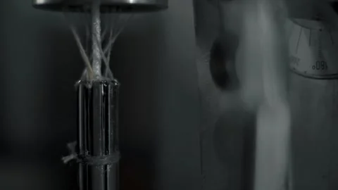 Creating a rope from caprone threads with a special machine. Ultra close-up. Stock Footage 179713964