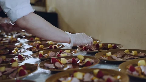 Creating snacks in the catering kitchen Stock Footage 167484428