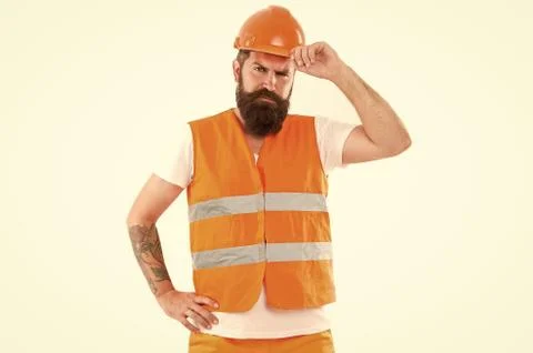 Creating solid foundation. Man protective hard hat and uniform white background 库存照片