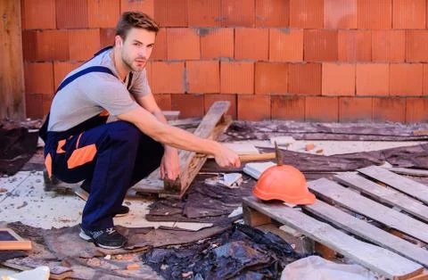 Creating solid foundation. worker brick wall background. building and Stock Photos