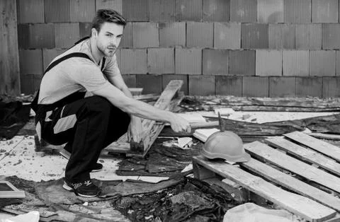 Creating solid foundation. worker brick wall background. building and Stock Photos