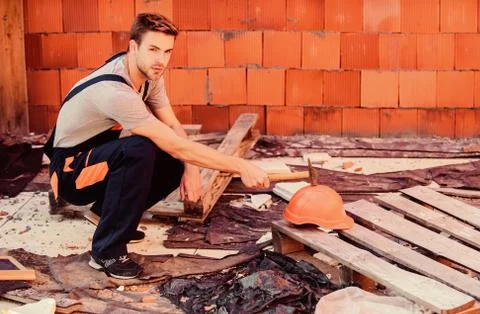 Creating solid foundation. worker brick wall background. building and 库存照片