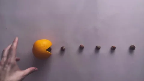 Creating a stop motion video of Pacman devouring fruit Stock Footage 262232258