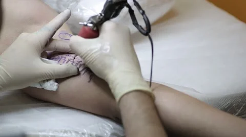 Creating a tattoo on the inside of an arm Stock Footage 61742632