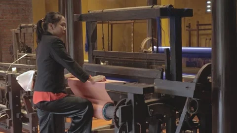 Creating textiles in a traditional weaving workshop in Vietnam Stock Footage 308835940