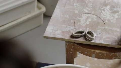 Creating unique ceramic art with pottery hands in a serene studio setting Stock Footage 321541309