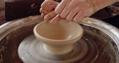 Creating vase of white clay close-up. Sculptor in workshop makes jug out of clay Stock Footage 208076196