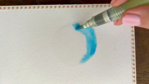 Creating a watercolour gradient from blue to yellow and orange. Mixing green out 스톡 동영상 172413925