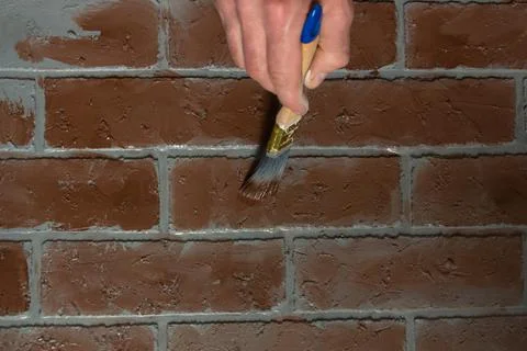 Creation of artificial bricks, the process of painting a photographic background Stock Photos