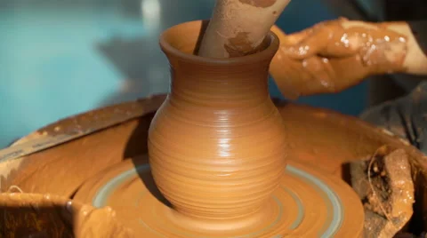 Creation of clay pot. Close up of hands working clay on potter's wheel Stock Footage 69010280