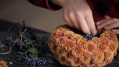Creation composition of chrysanthemums and berries by florist Stock Footage 71402761