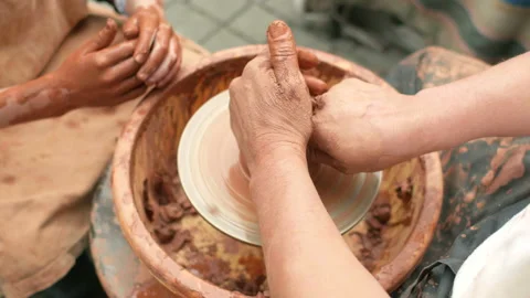 Creation covers a clay pot. Stock Footage 95072502