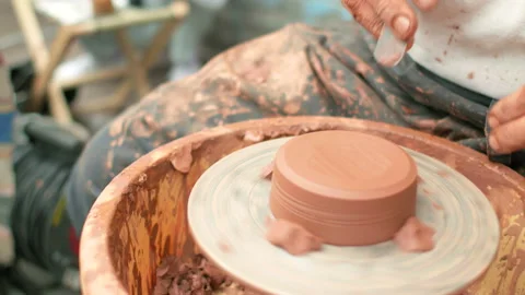 Creation covers a clay pot. Stock Footage 95074246