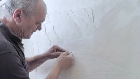 Creation of decorative panels on the wall Stock Footage 133632304