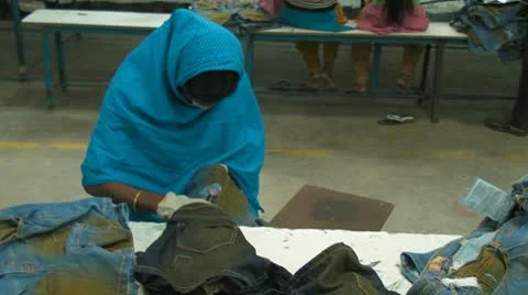 The Creation of Destroyed Jeans Stock Footage 10703138