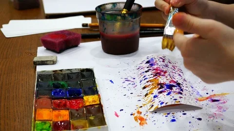 Creation of a multi-colored texture by spraying paint with an artist's brush. Stock Footage 76728054