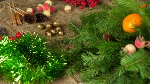 Creation of a table Christmas composition. Women's hands decorate the Stock Footage 116492514